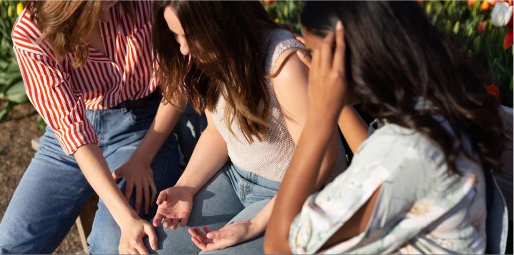 Three teenage girls talking