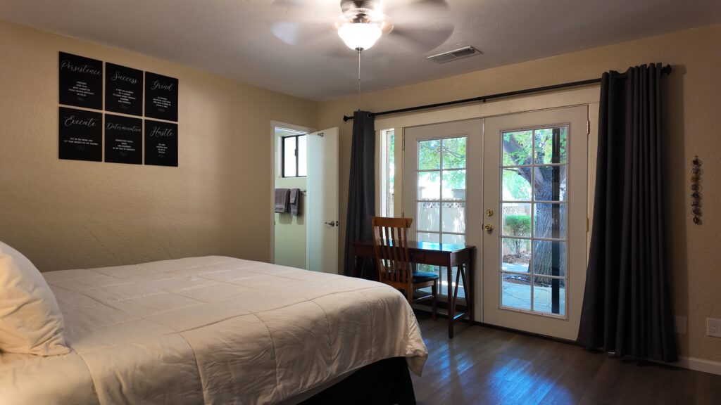 Bedroom with French doors at the ATMC residence in Sedona