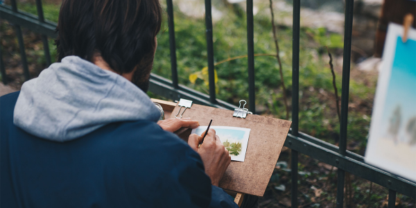 person drawing outside